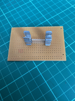 Attaching the Re-Fuse-It clips.