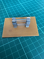 Inserting the replaement fuse.